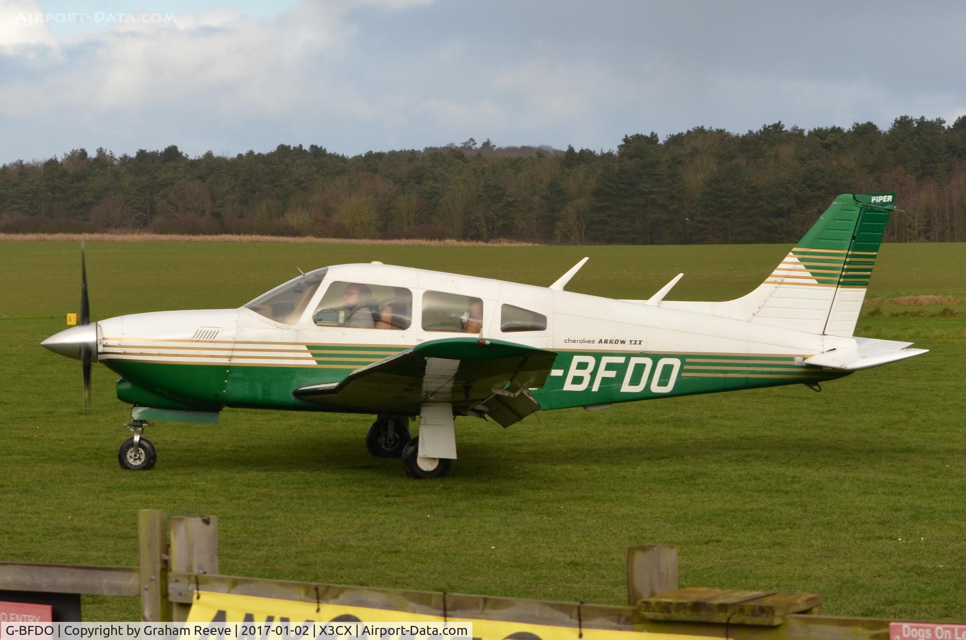 G-BFDO, 1977 Piper PA-28R-201T Cherokee Arrow III C/N 28R-7703212, Just landed at Northrepps.