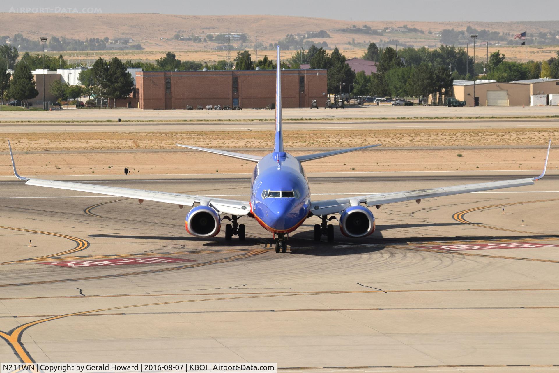 N211WN, 2005 Boeing 737-7H4 C/N 34163, Turning off RWY 28R for the gate.