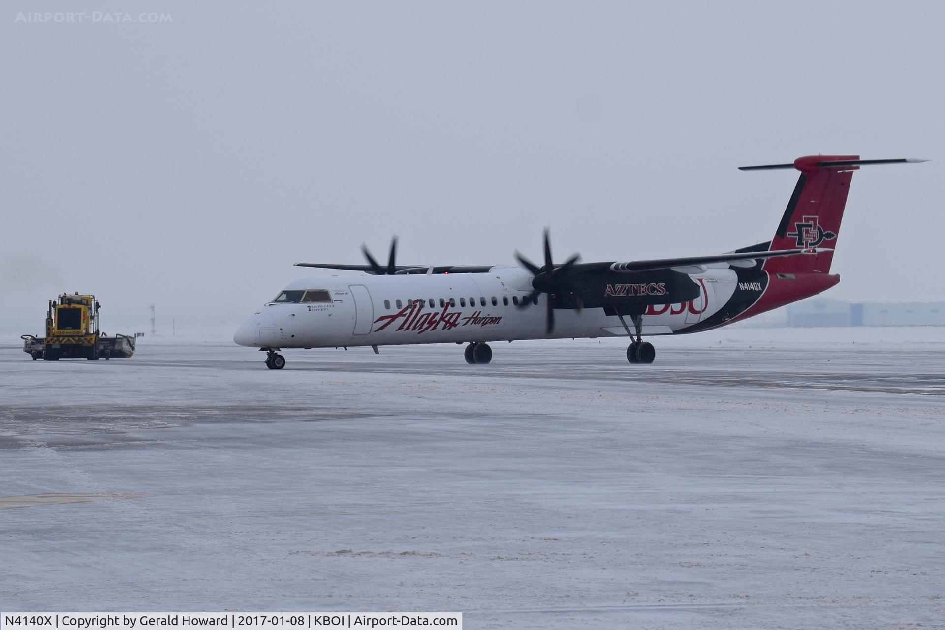 N4140X, 1968 Aero Commander 100 C/N 240, Snow removal equipment and arriving aircraft work together.