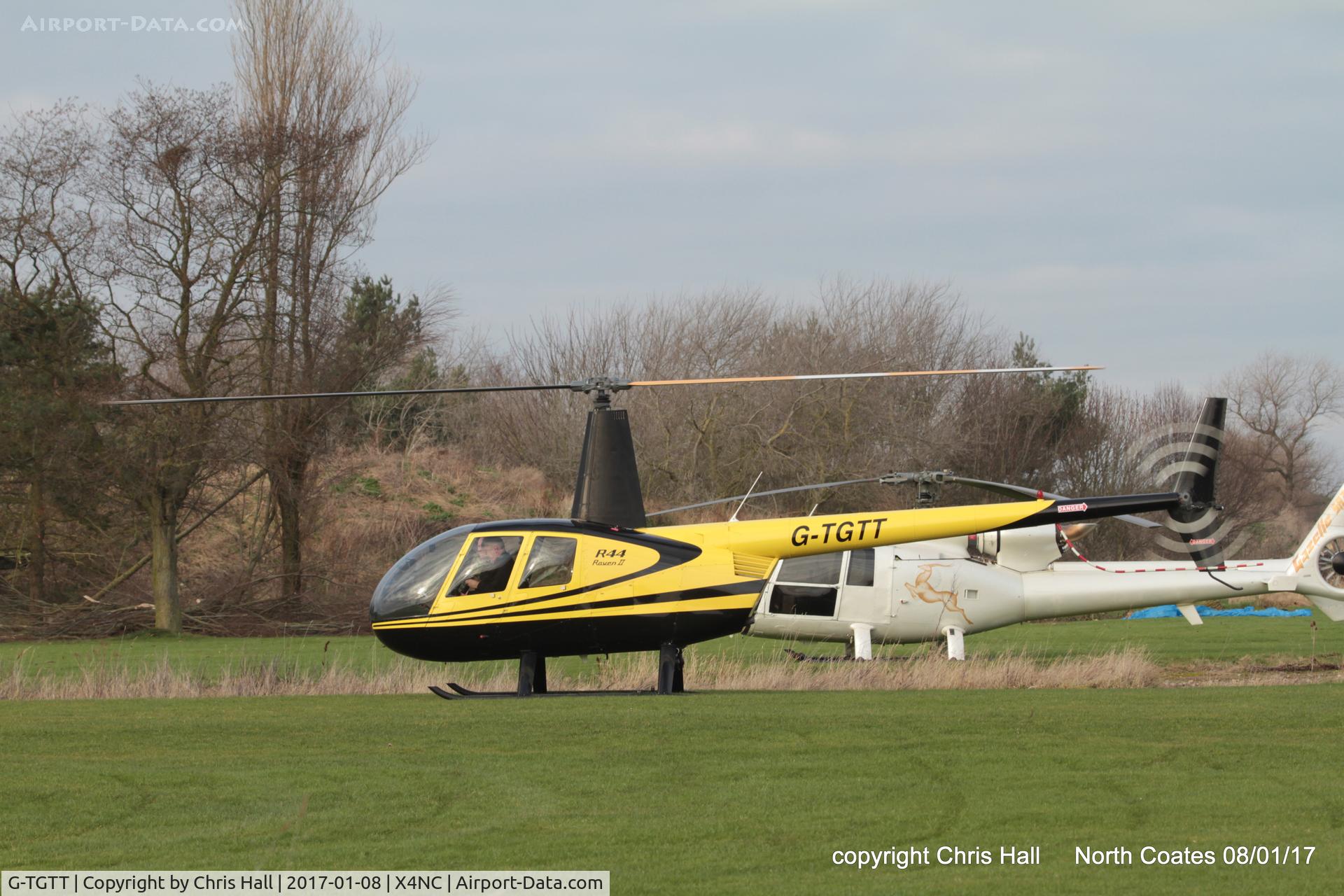 G-TGTT, 2002 Robinson R44 Raven II C/N 10023, at the Brass Monkey fly in, North Coates