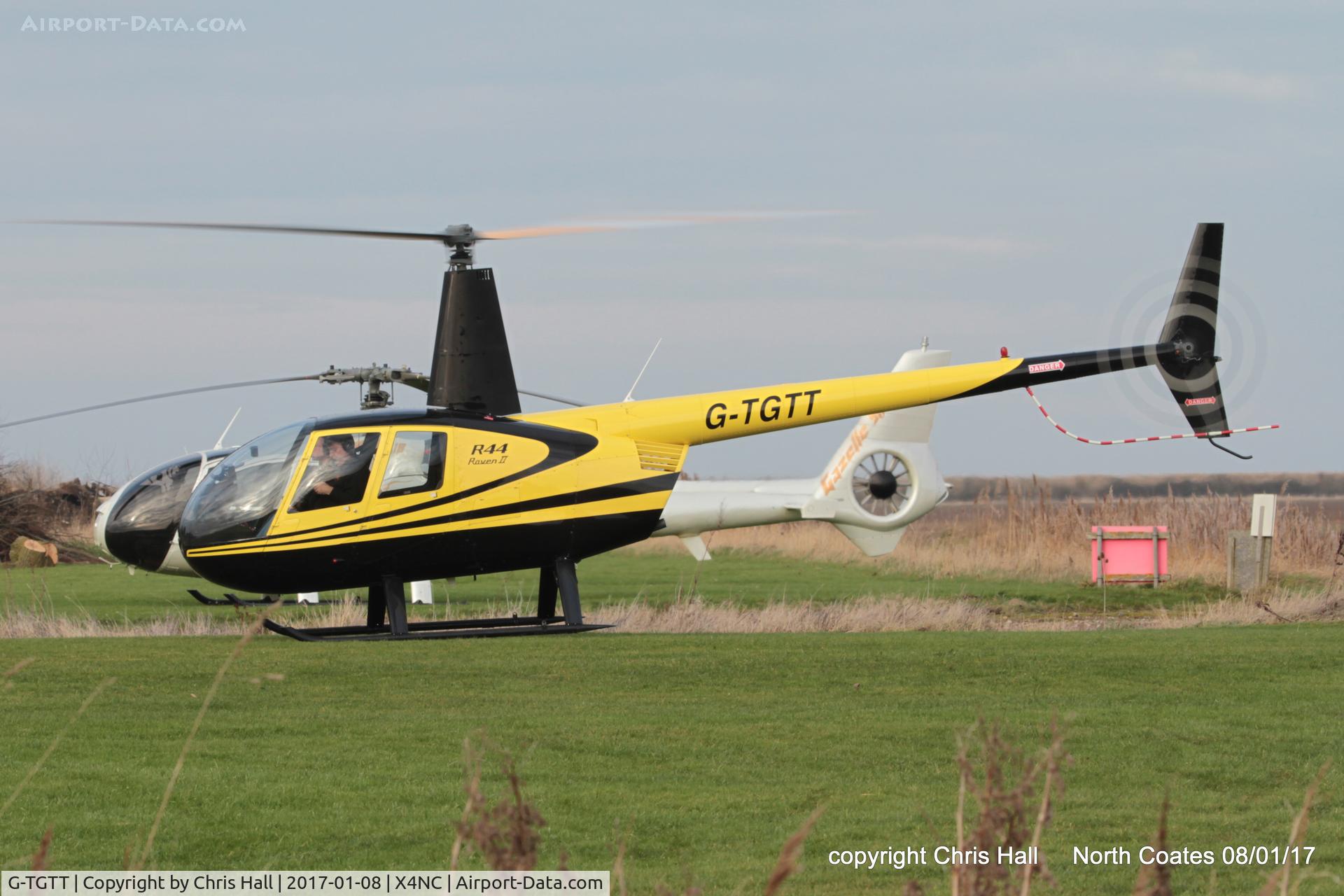 G-TGTT, 2002 Robinson R44 Raven II C/N 10023, at the Brass Monkey fly in, North Coates