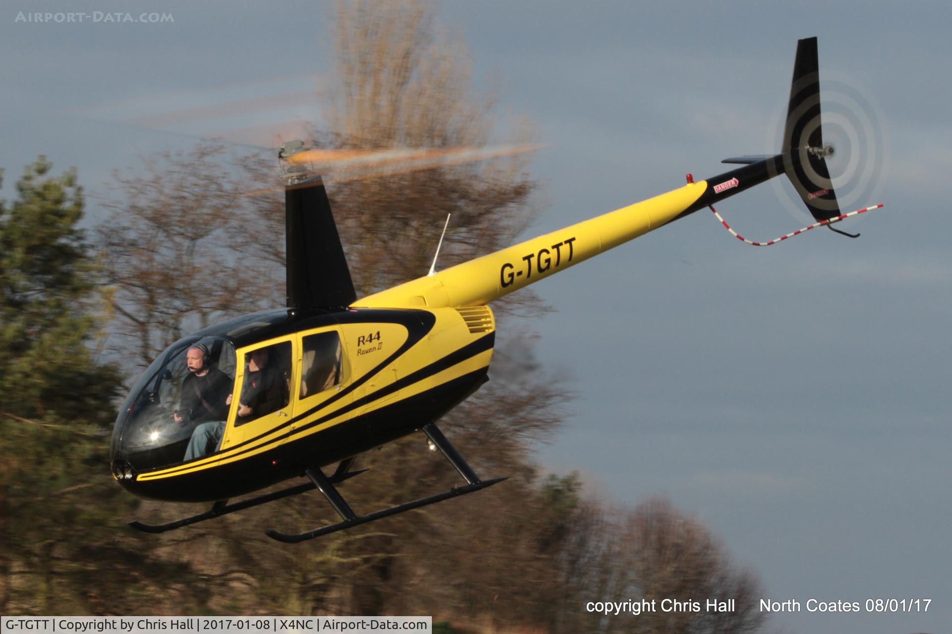 G-TGTT, 2002 Robinson R44 Raven II C/N 10023, at the Brass Monkey fly in, North Coates