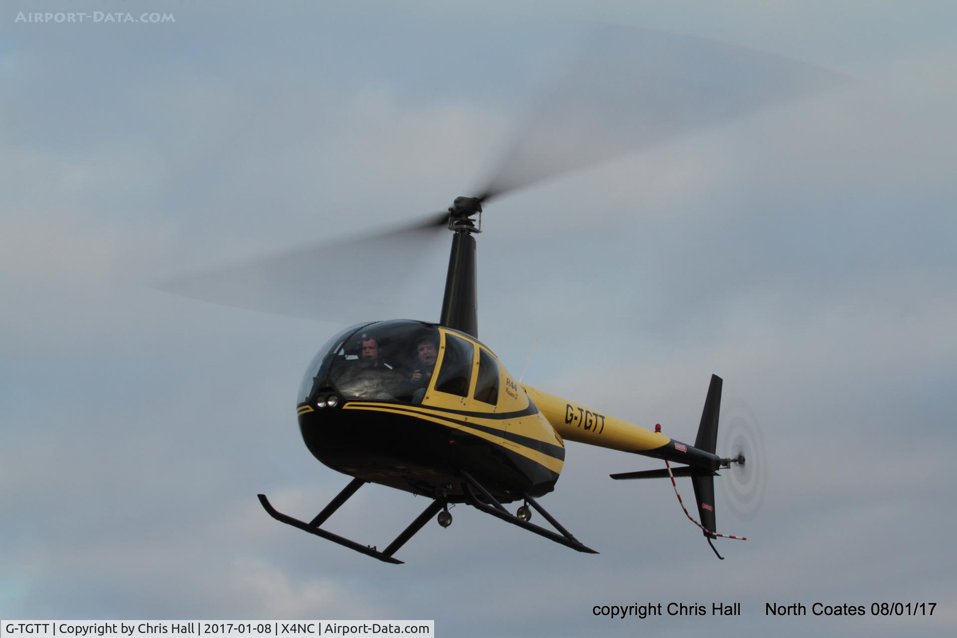 G-TGTT, 2002 Robinson R44 Raven II C/N 10023, at the Brass Monkey fly in, North Coates