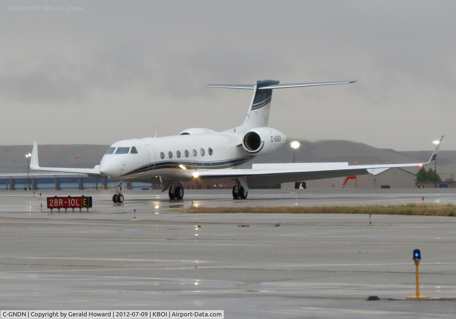 C-GNDN, 2015 Gulfstream Aerospace G650 (G-VI) C/N 6162, Turning off RWY 28R. Very wet morning.