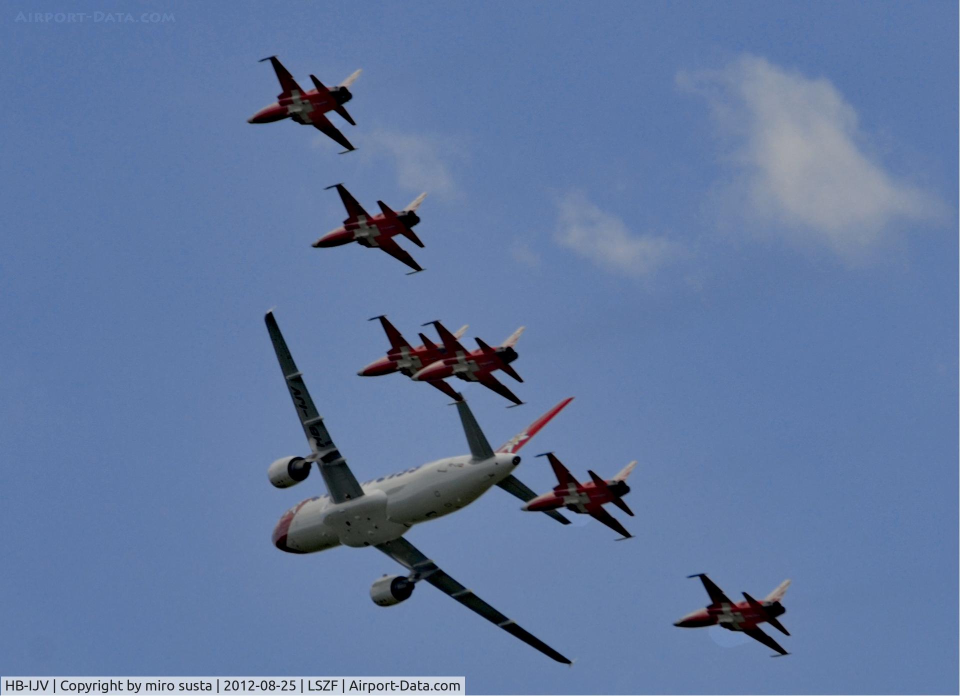 HB-IJV, 2003 Airbus A320-214 C/N 2024, Edelweiss Airlines Airbus A320 airplane in company of Swiss Air Force Northrop F-5E Tiger II Airplanes during air-show at Birrfeld airfield in Switzerland