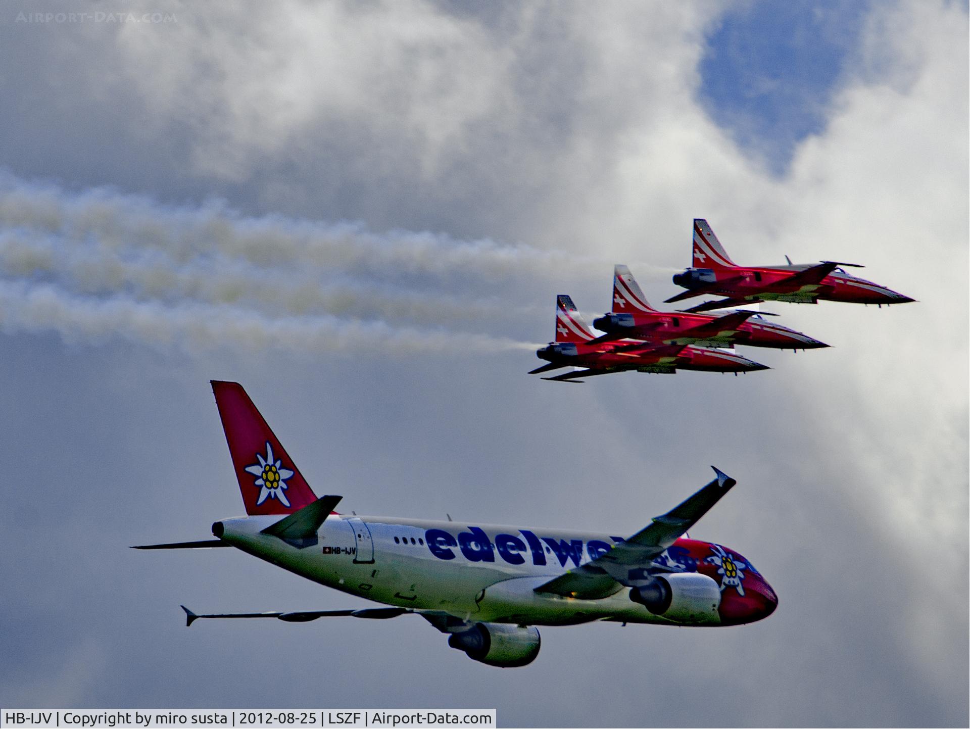 HB-IJV, 2003 Airbus A320-214 C/N 2024, Edelweiss Airlines Airbus A320 airplane in company of Swiss Air Force Northrop F-5E Tiger II Airplanes during air-show at Birrfeld airfield in Switzerland