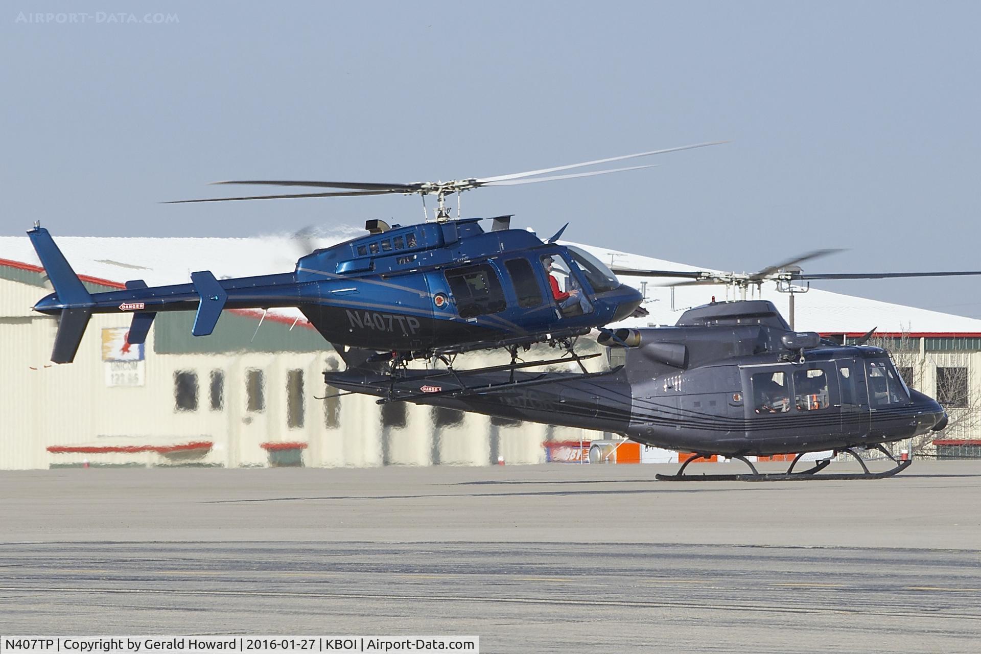 N407TP, 2005 Bell 407 C/N 53654, Landing on north GA ramp along with N37GR.
