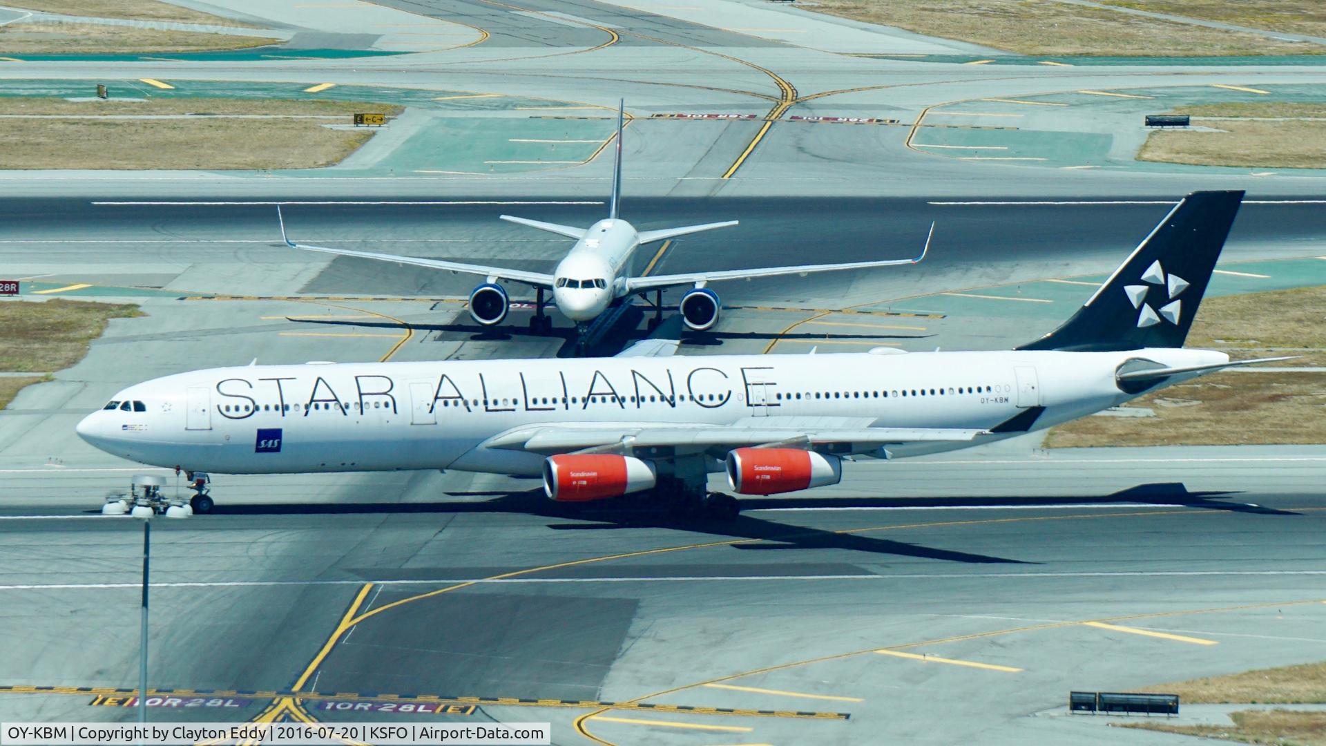 OY-KBM, 2002 Airbus A340-313X C/N 450, Shot taken from the new tower at SFO. 2016.