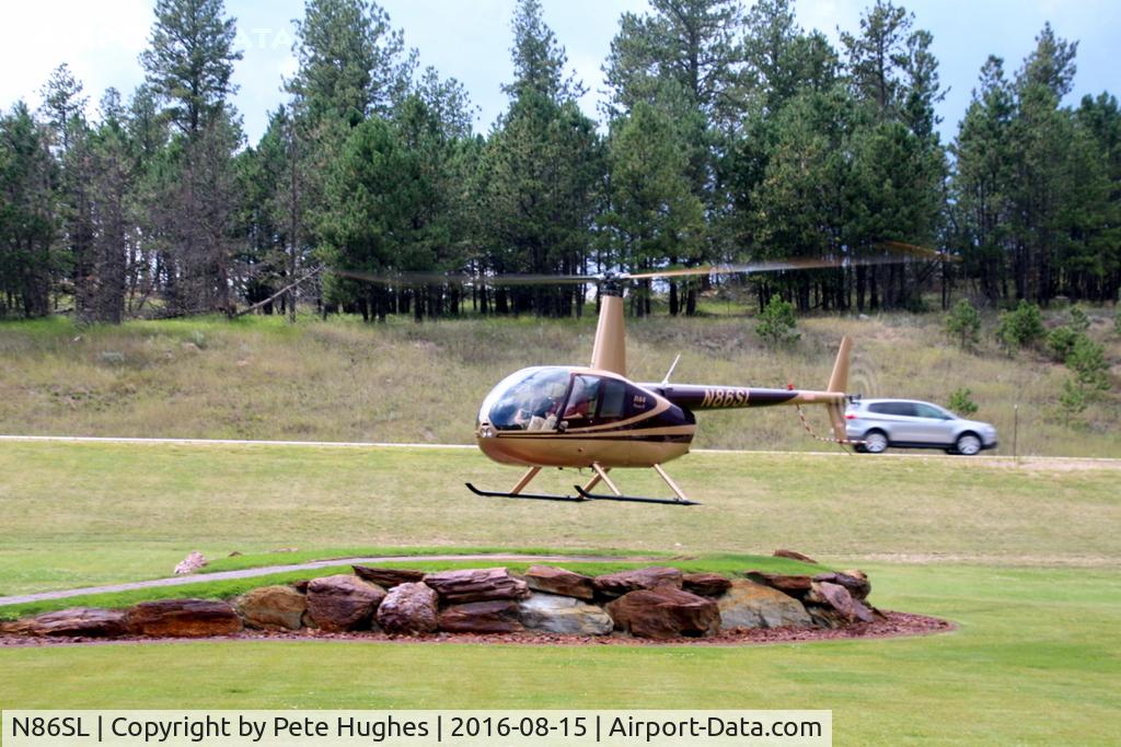 N86SL, 2004 Robinson R44 II C/N 10375, N86SL R44 departing a roadside helipad near Custer SD