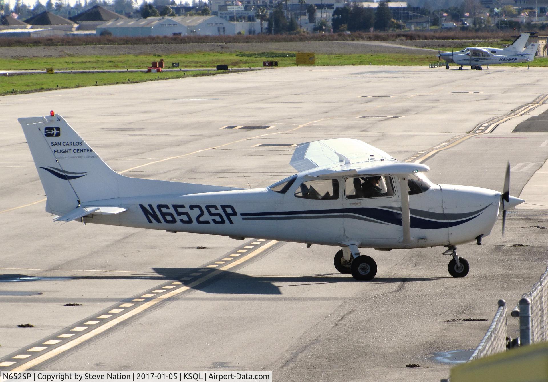 N652SP, 1998 Cessna 172S C/N 172S8058, San Carlos Flight Center 1998 Cessna 172S Skyhawk taxiing in @ KSQL home base