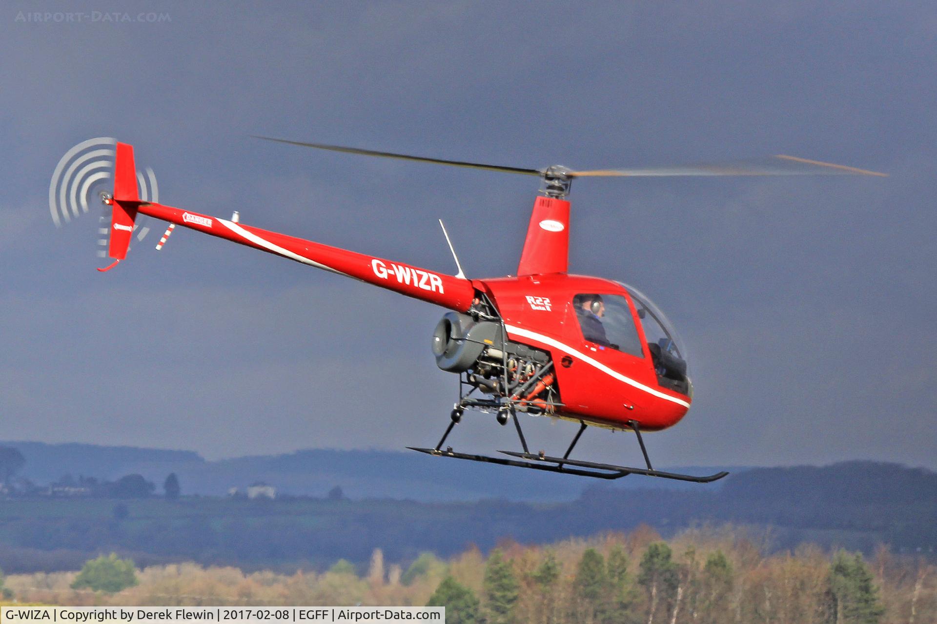 G-WIZA, 1988 Robinson R22 Beta C/N 0861, R22 Beta, Gloucester Staverton based, previously N90815, G-PERL, seen hover taxxing prior to departing.