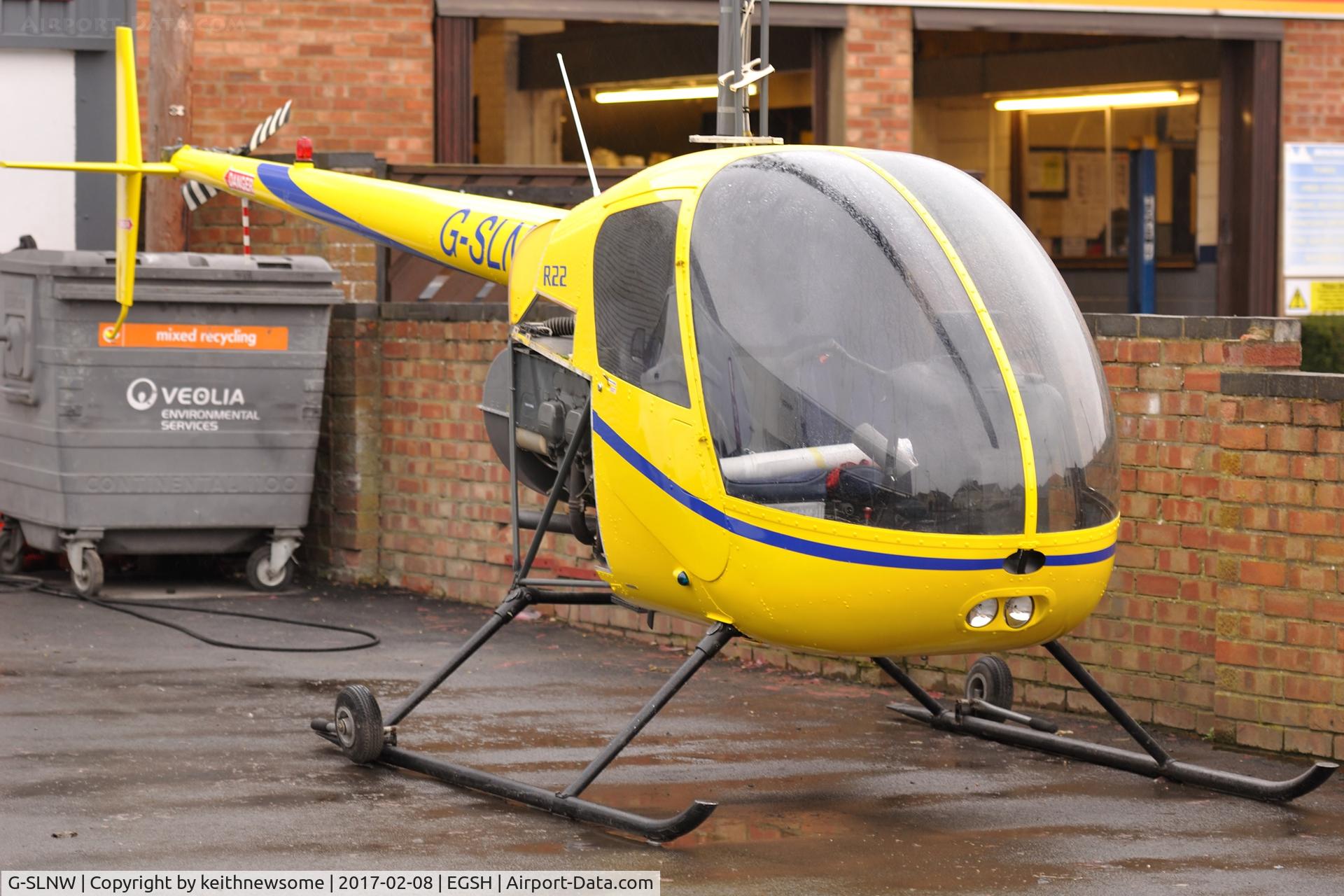 G-SLNW, 2003 Robinson R22 Beta II C/N 3524, Off Airport on local garage forecourt.