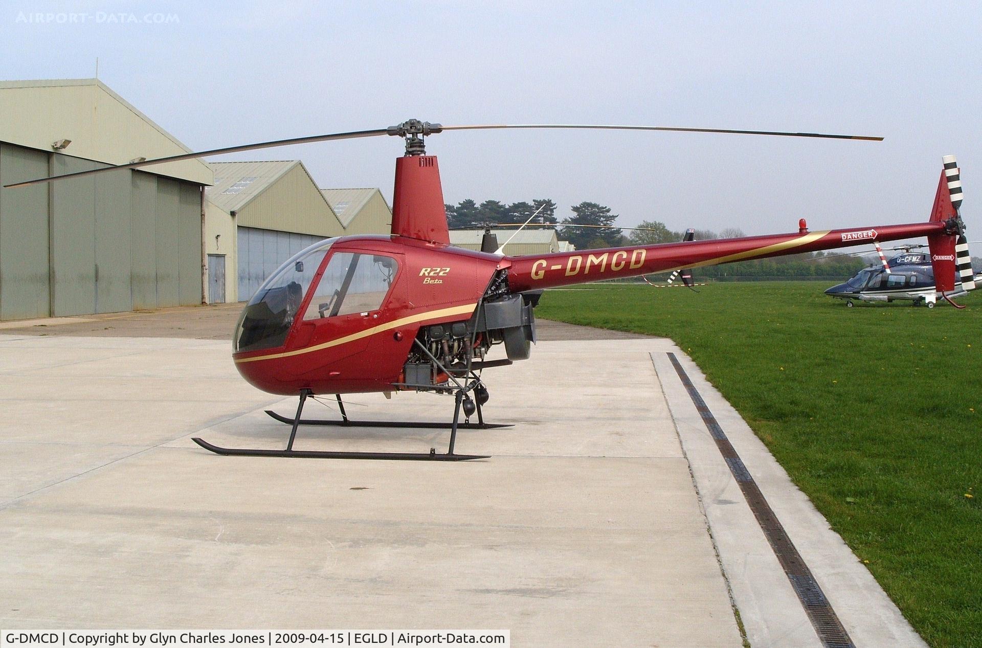 G-DMCD, 1989 Robinson R22 Beta C/N 1201, With thanks to the chief engineer of Heli Air who granted me authority to take photographs on this part of the aerodrome. Previously G-OOLI.