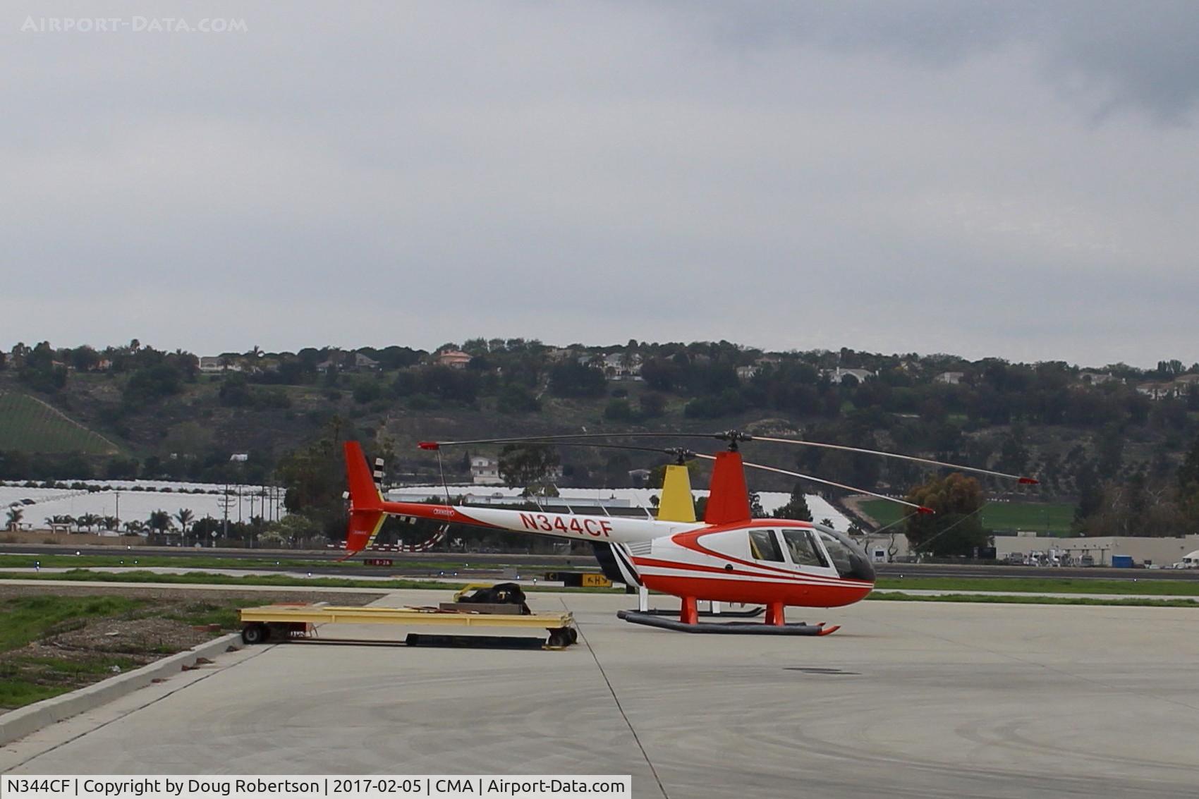 N344CF, 2004 Robinson R44 Raven II C/N 10440, 2004 Robinson R44 RAVEN II, one Lycoming IO-540-AE1A5 6 cylinder flat rated to 245 bHp, 4 seats, at SUN AIR ramp.