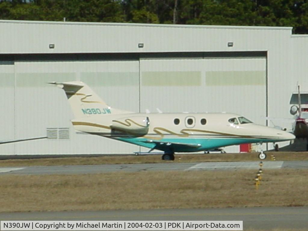 N390JW, Raytheon Aircraft Company 390 C/N RB-78, Sitting outside hanger