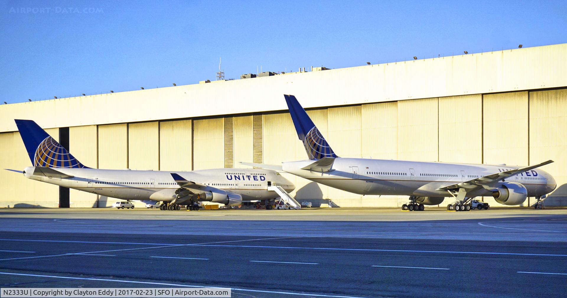 N2333U, 2016 Boeing 777-300/ER C/N 62644, 747-400 next to it's new replacement, 777-300er. SFO. 2017.