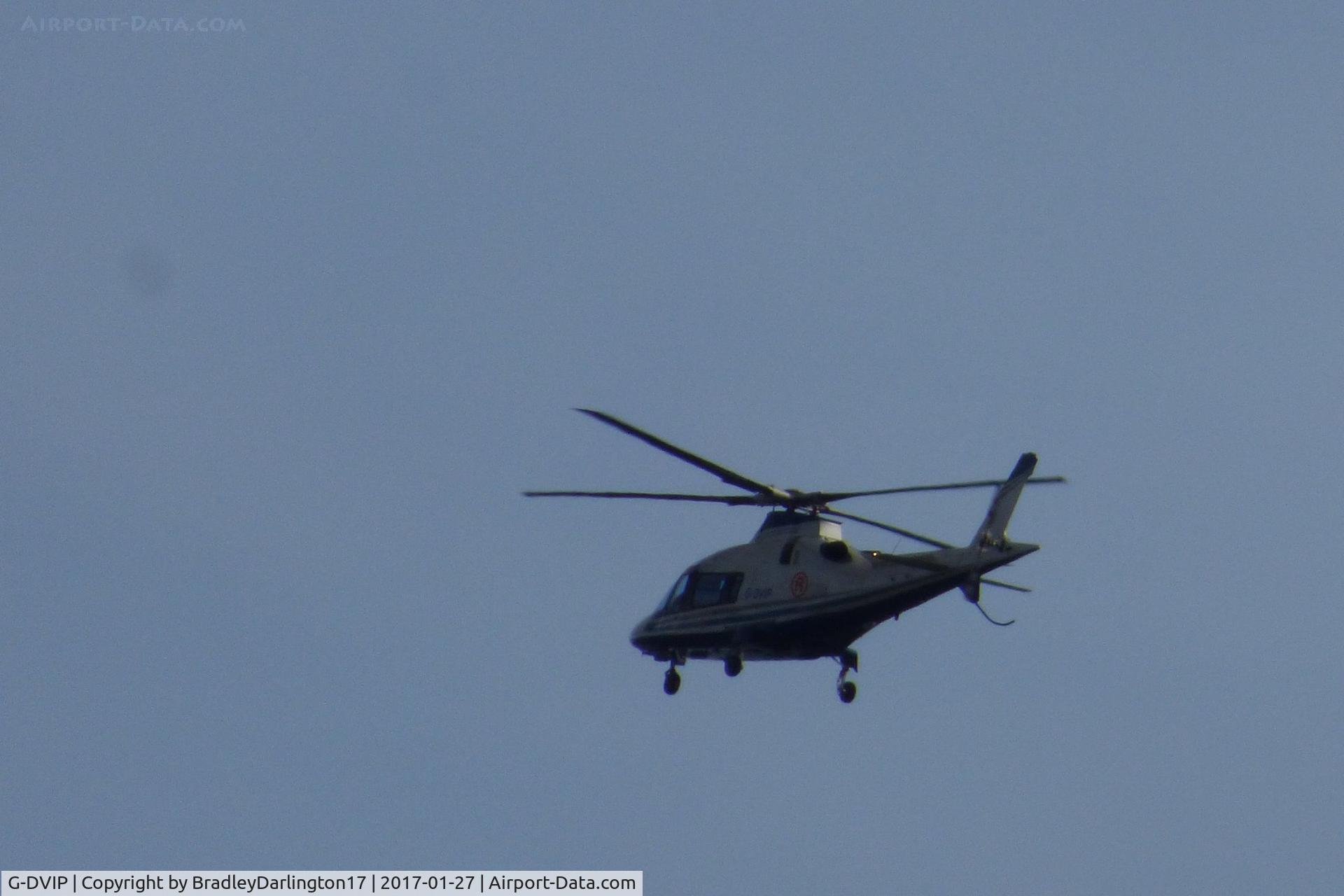 G-DVIP, 2003 Agusta A-109E Power C/N 11217, going into land at the old plymouth airport or a near by grass area, helicopter for the Range 