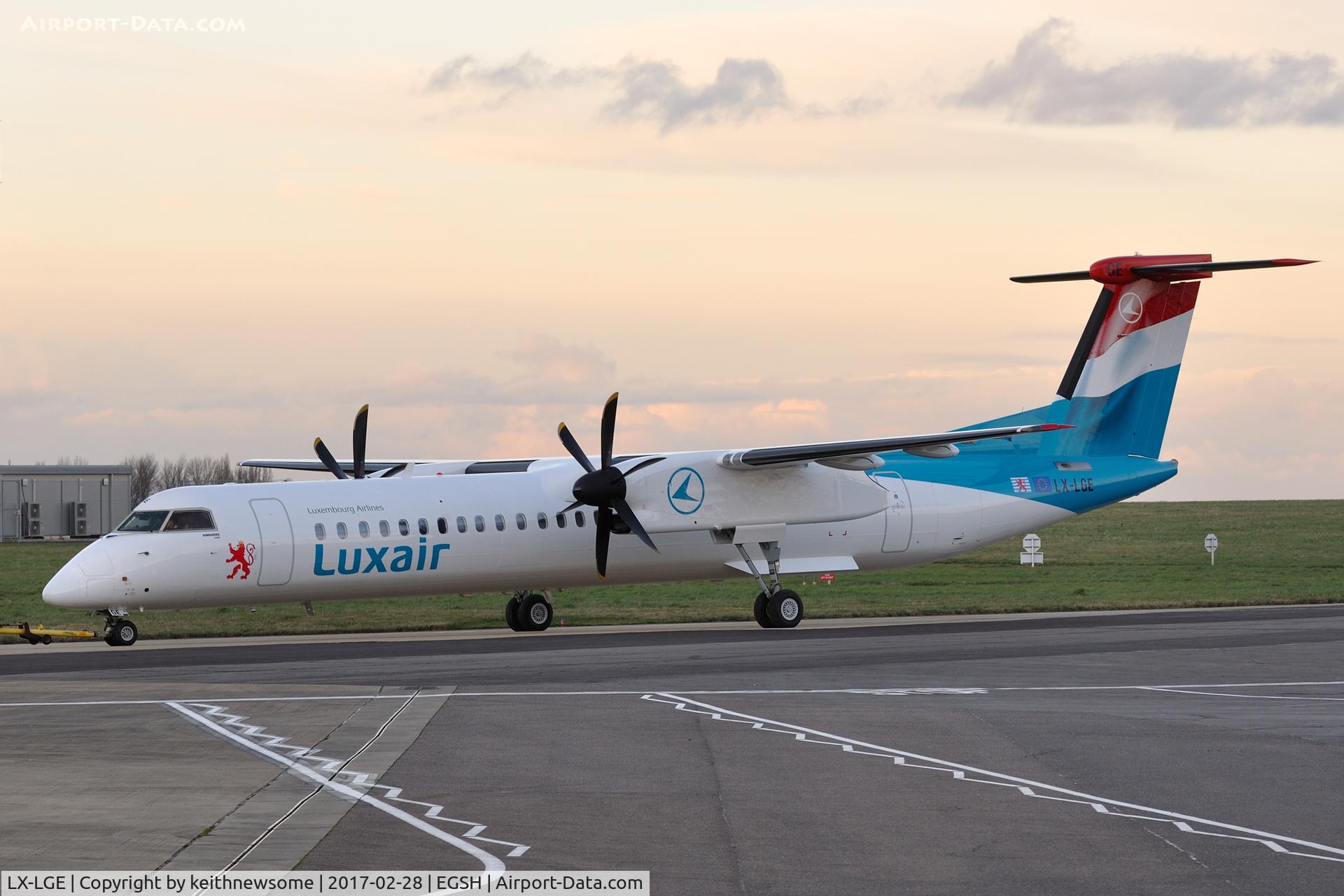 LX-LGE, 2009 De Havilland Canada DHC-8-402Q Dash 8 C/N 4284, Early evening removal from paint.