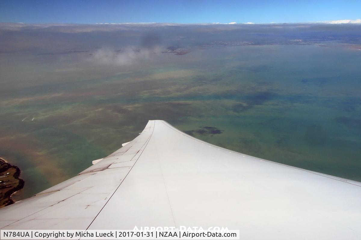 N784UA, 1997 Boeing 777-222/ER C/N 26951, Climbing out of AKL, and commencing the long journey to SFO