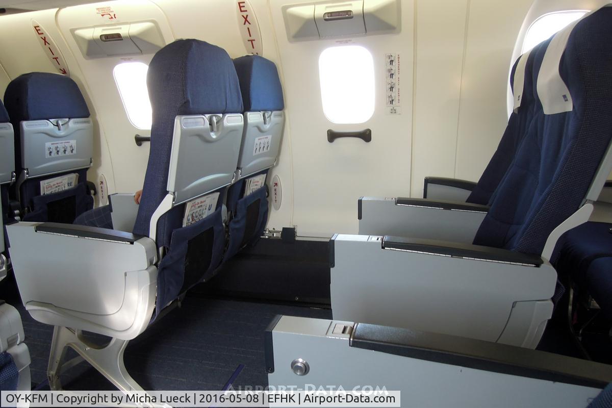OY-KFM, 2010 Bombardier CRJ-900LR (CL-600-2D24) C/N 15250, Extra legroom at emergency exit