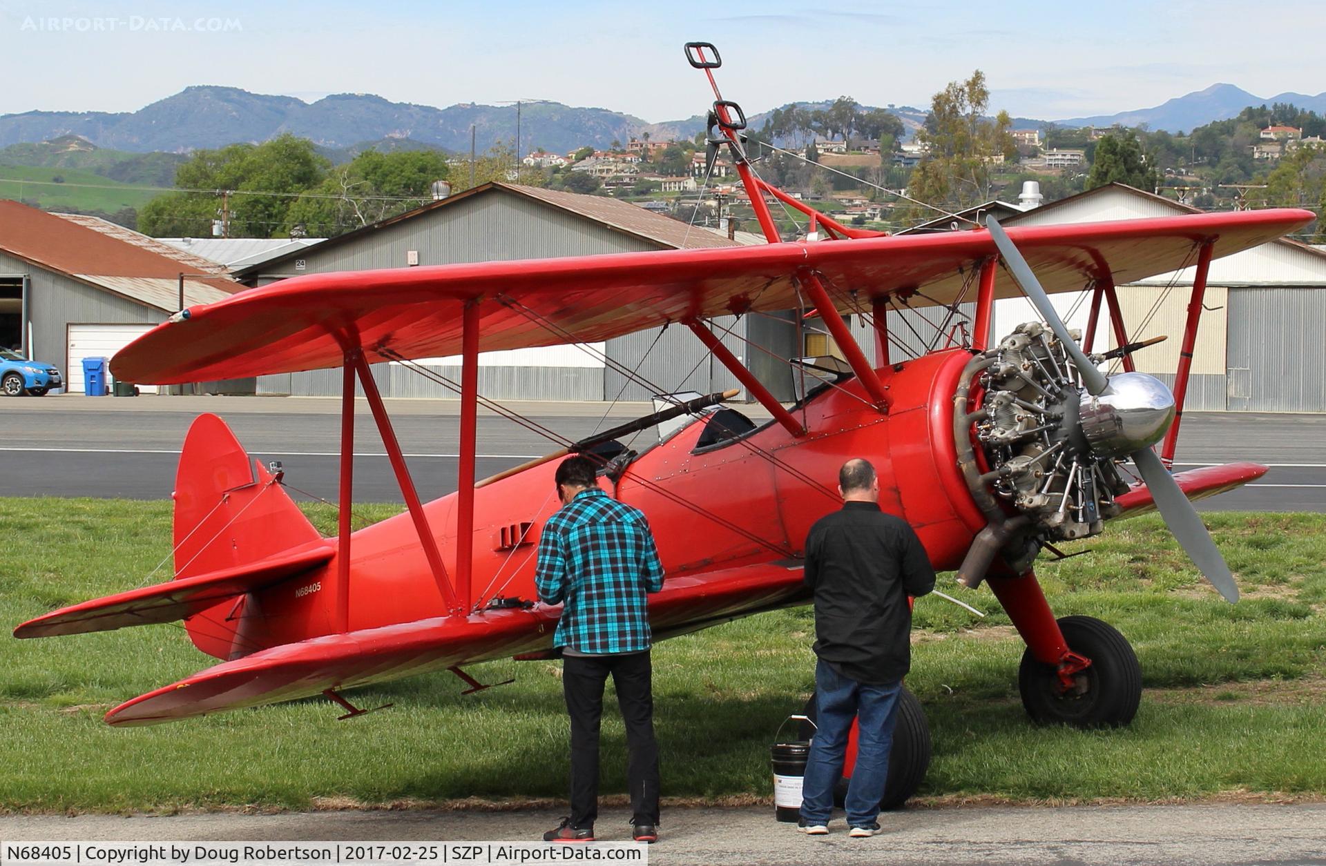N68405, 1943 Boeing A75N1(PT17) C/N 75-7759, 1943 Boeing Stearman A75N1(PT-17), P&W R-985 450 Hp Wasp Jr. upgrade conversion, wingwalker/stander? equipped. Near SZP Helipad.