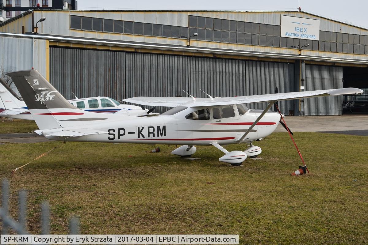 SP-KRM, 2003 Cessna T182T Turbo Skylane C/N T18208198, Standing in front of IBEX hangar.