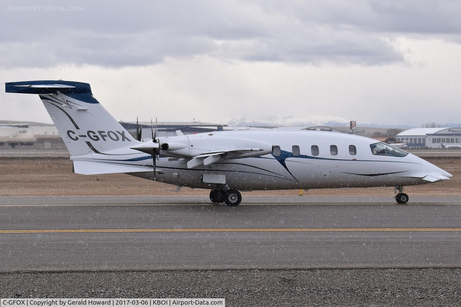 C-GFOX, 2003 Piaggio P-180 Avanti C/N 1065, Taxiing on Alpha just as the snow started to fall. Belongs to the RCMP, Ottawa, Canada.