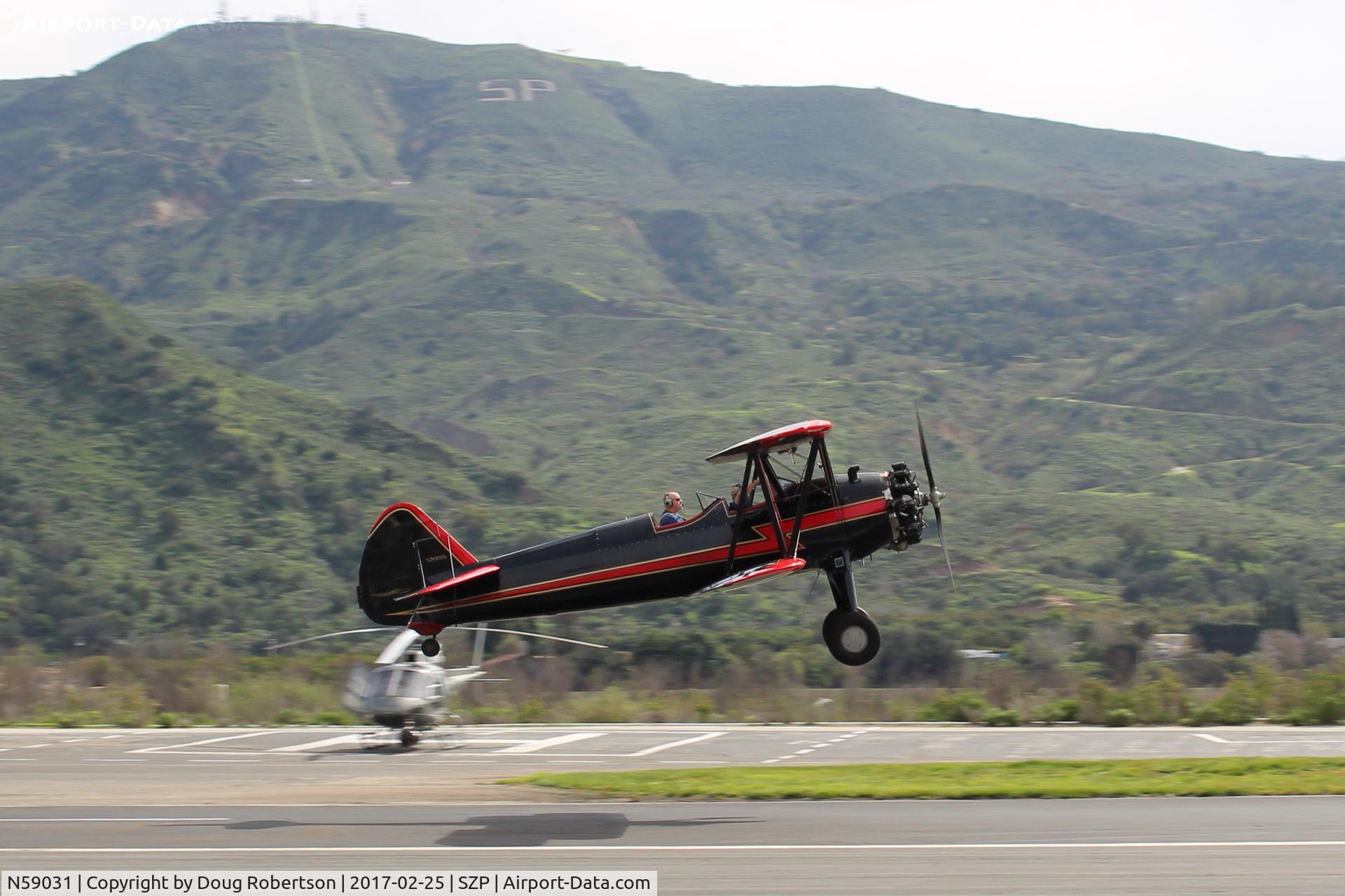 N59031, 1941 Boeing A75N1(PT17) C/N 75-3808, 1941 Boeing Stearman A75N1 (PT-17), Continental W670 220 Hp radial, another takeoff climb Rwy 22