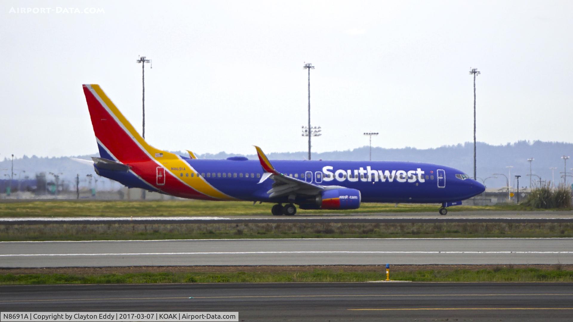 N8691A, 2016 Boeing 737-8H4 C/N 36945, Departing runway 28R at North Field Oakland Airport.