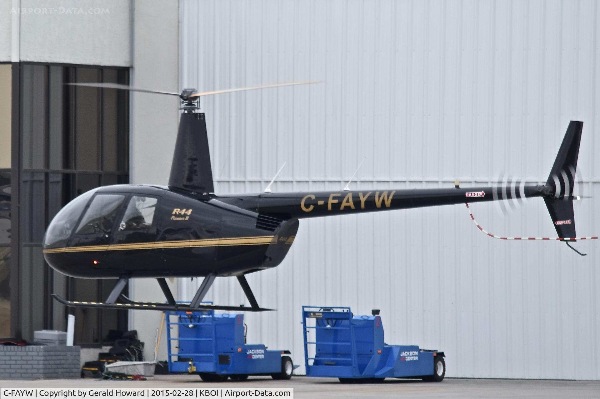 C-FAYW, 2003 Robinson R44 II C/N 10122, Hover taxi on the north GA ramp.