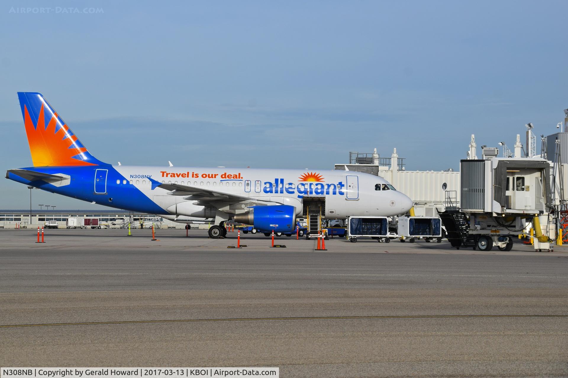 N308NB, 1999 Airbus A319-114 C/N 1129, Parked at the gate.