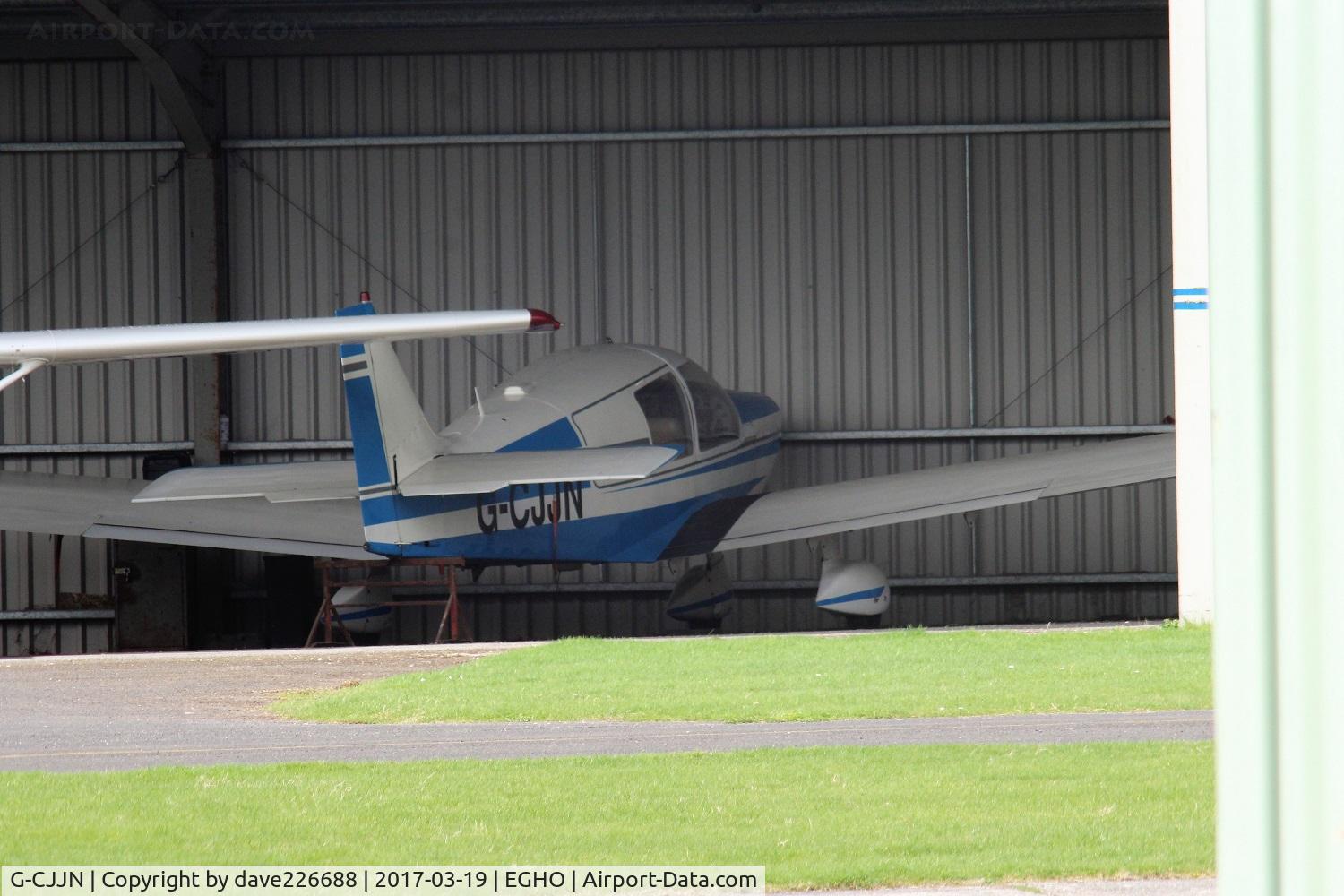 G-CJJN, 1973 Robin HR-100-210 Safari C/N 169, G CJJN hiding away in the lower hanger area at Thruxton
