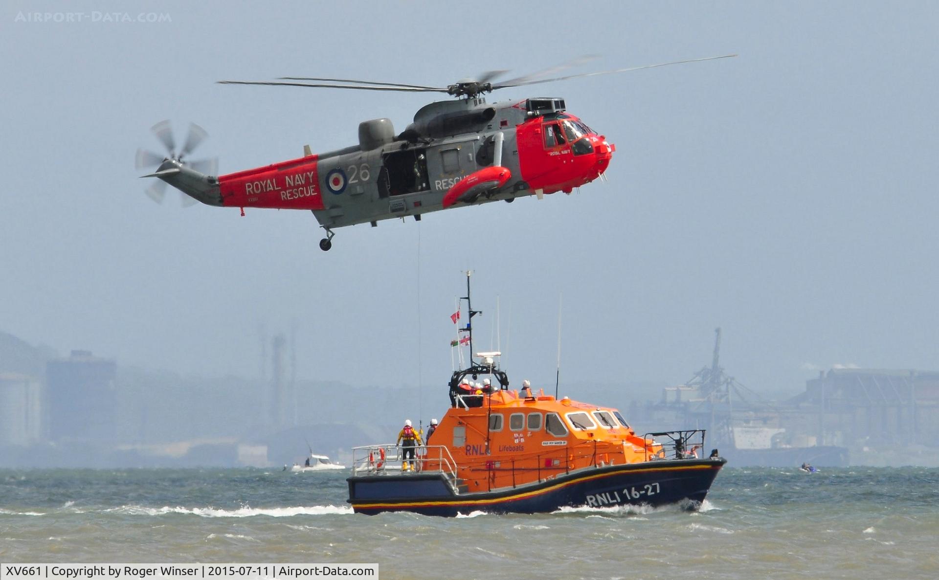 XV661, 1970 Westland Sea King HU.5 C/N WA649, Off airport. Royal Navy SAR helicopter modex (8)26/CU of 771 NAS undertaking an exercise with The Mumbles Lifeboat RNLI 16-27 in Swansea Bay during the Wales National Airshow 2015.