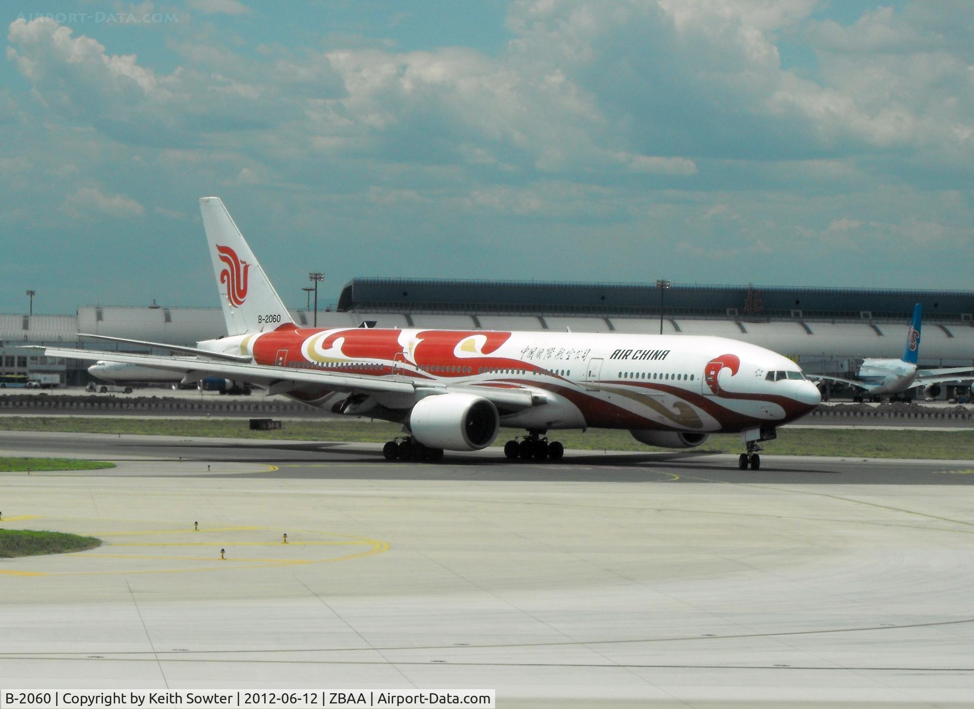 B-2060, 1998 Boeing 777-2J6 C/N 29154, Taken through glass