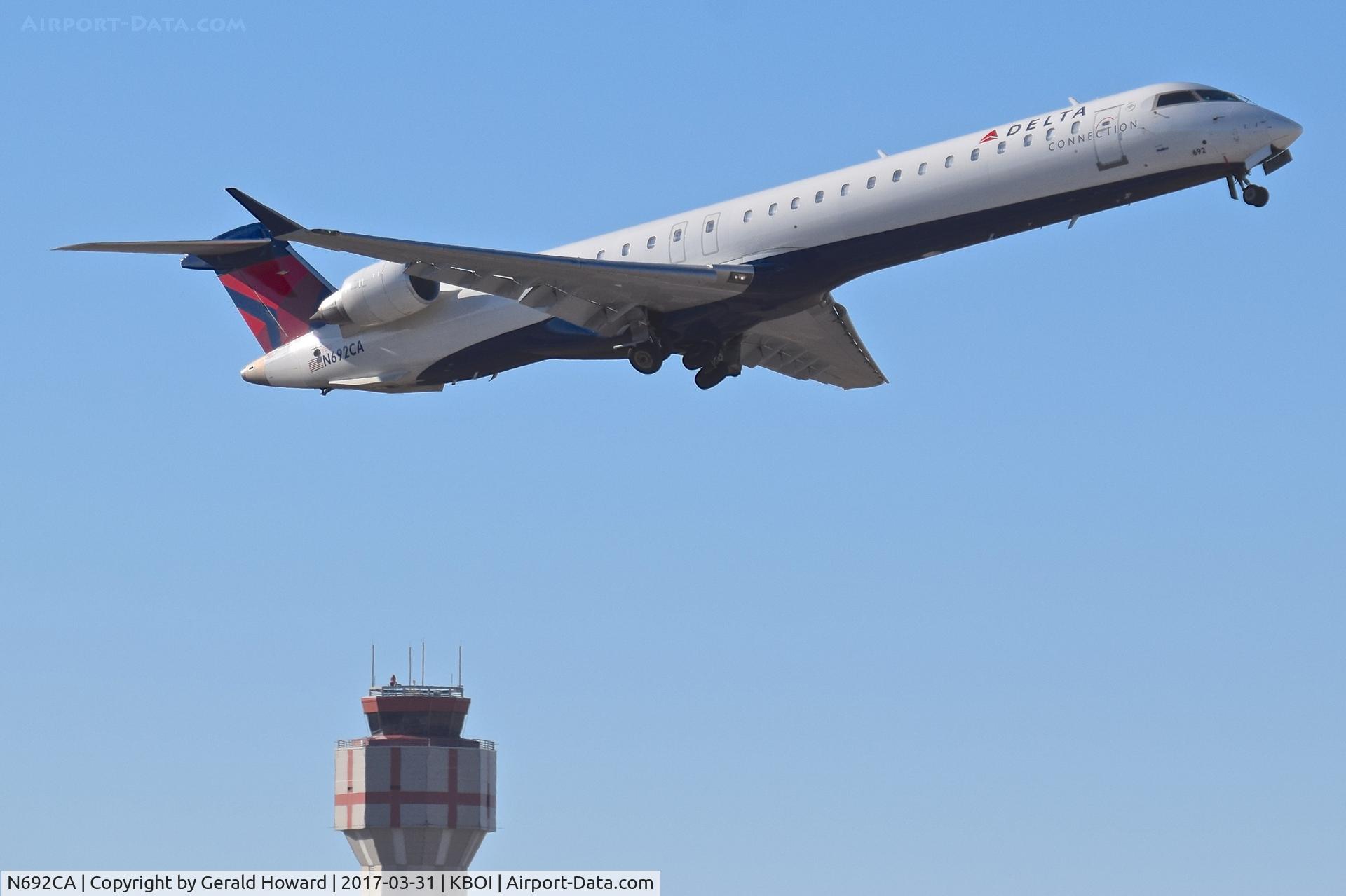 N692CA, 2006 Bombardier CRJ-900ER (CL-600-2D24) C/N 15092, Departing RWY 28R.