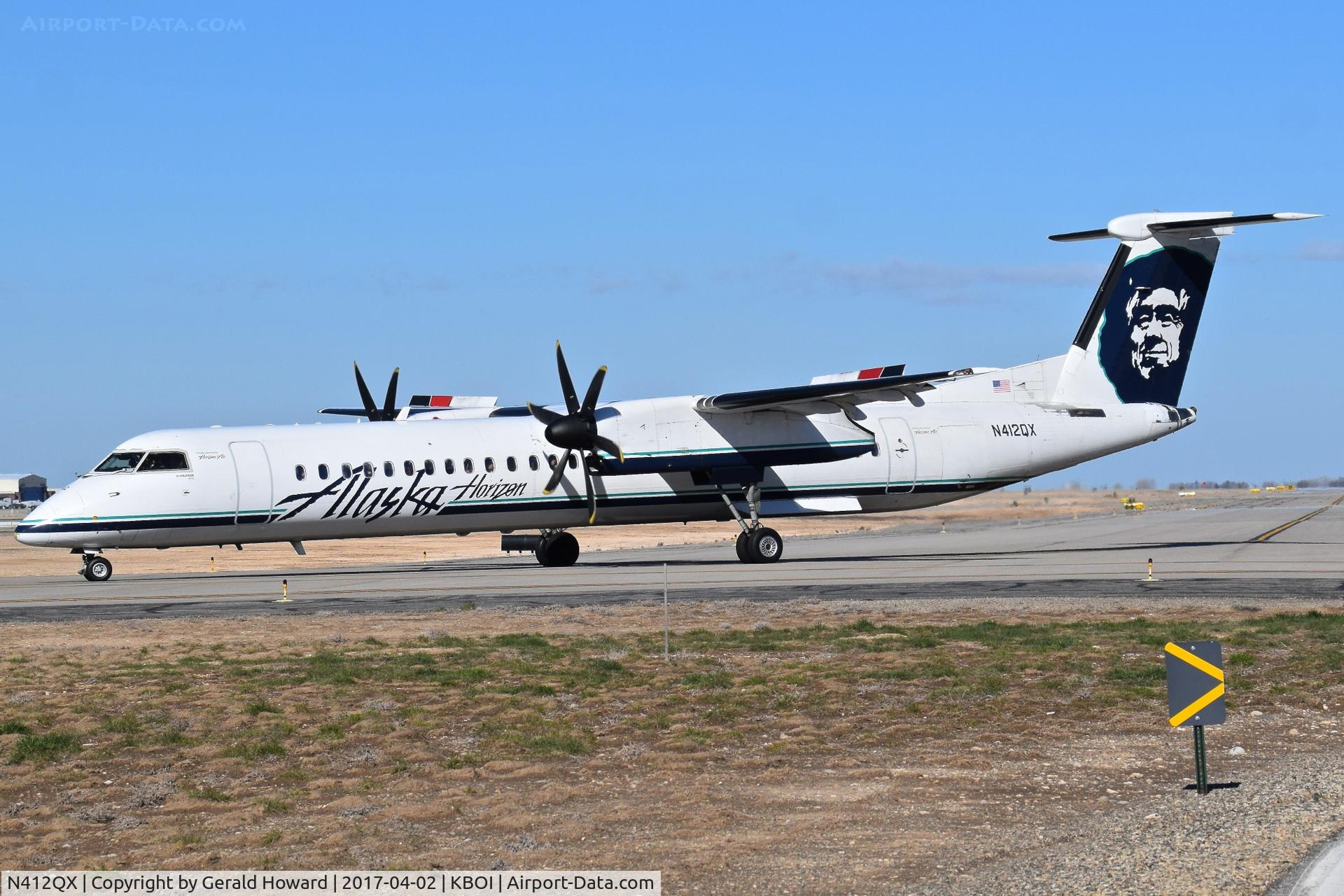 N412QX, 2002 Bombardier DHC-8-402 Dash 8 C/N 4059, Turning off Alpha for RWY 28R.