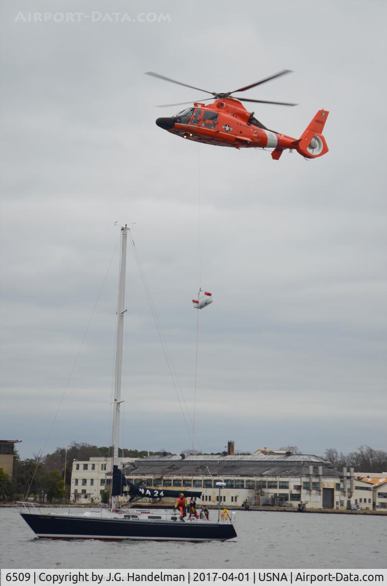 6509, 1985 Aérospatiale HH-65A Dolphin C/N 6104, Now a MH-65D.  Lowering rescue basket to a Navy 44 sloop.