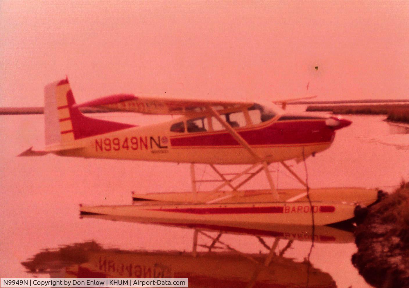 N9949N, 1975 Cessna 180J C/N 18052604, When the aircraft was used to support the oil industry down in Louisiana, photo taken 1975... a dollie boy backed her into the leading edge of another 180 and bent the rudder, Was waiting on the next 100 hr to have it painted...Was a fun aircraft to fly