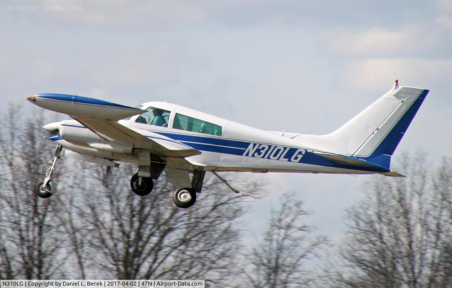 N310LG, 1966 Cessna 310K C/N 310K0206, Having just take off, this sleek 1966 Cessna 310 tucks in her long legs.