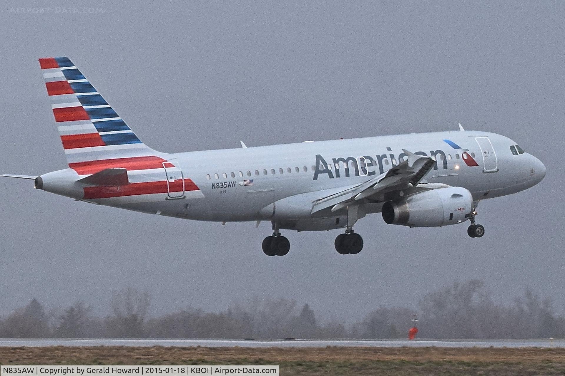 N835AW, 2005 Airbus A319-132 C/N 2458, Landing in the rain on RWY 10L.