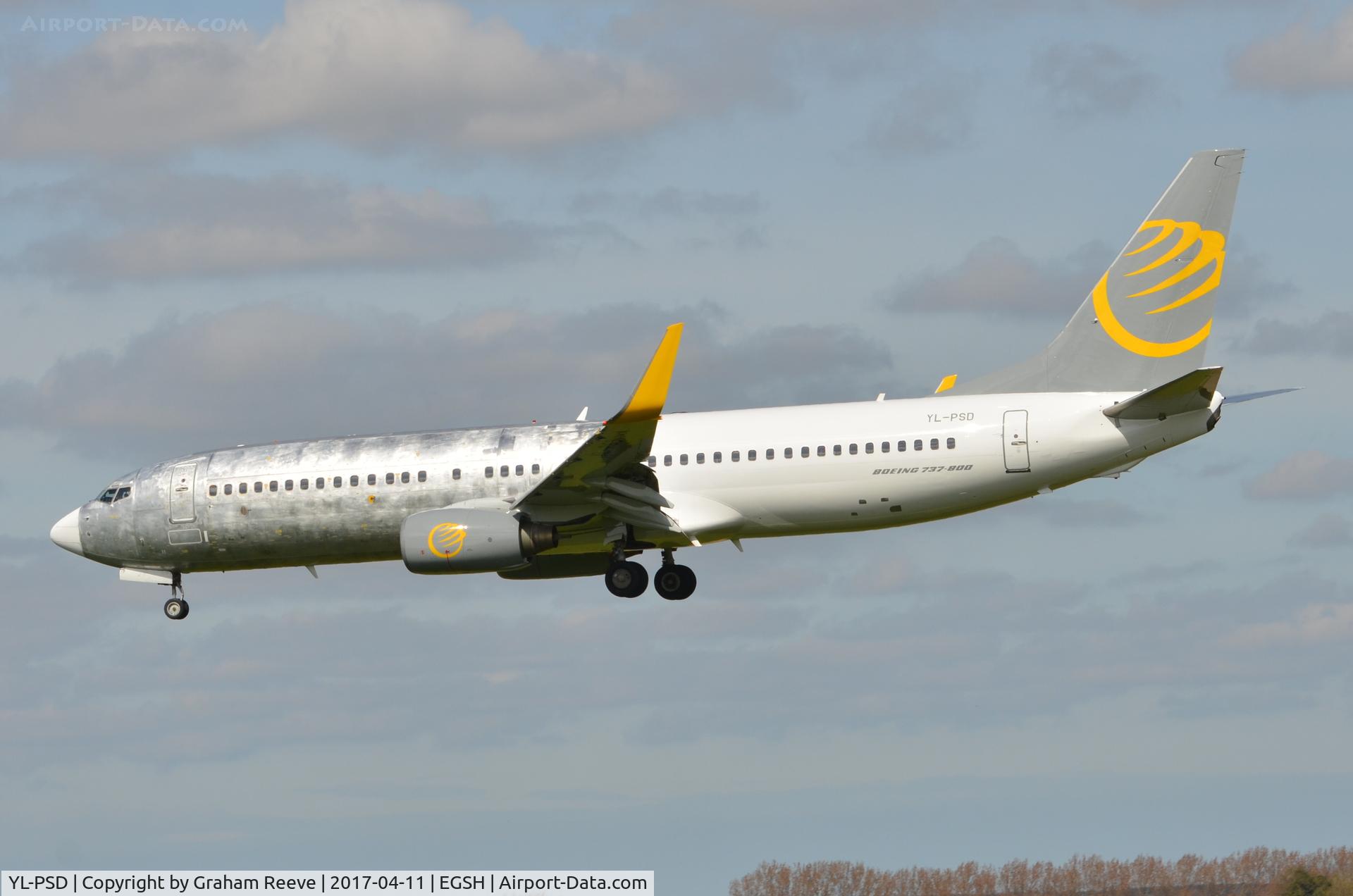 YL-PSD, 2000 Boeing 737-86N C/N 28618, Landing at Norwich with half the aircraft in bare metal and the other in livery.