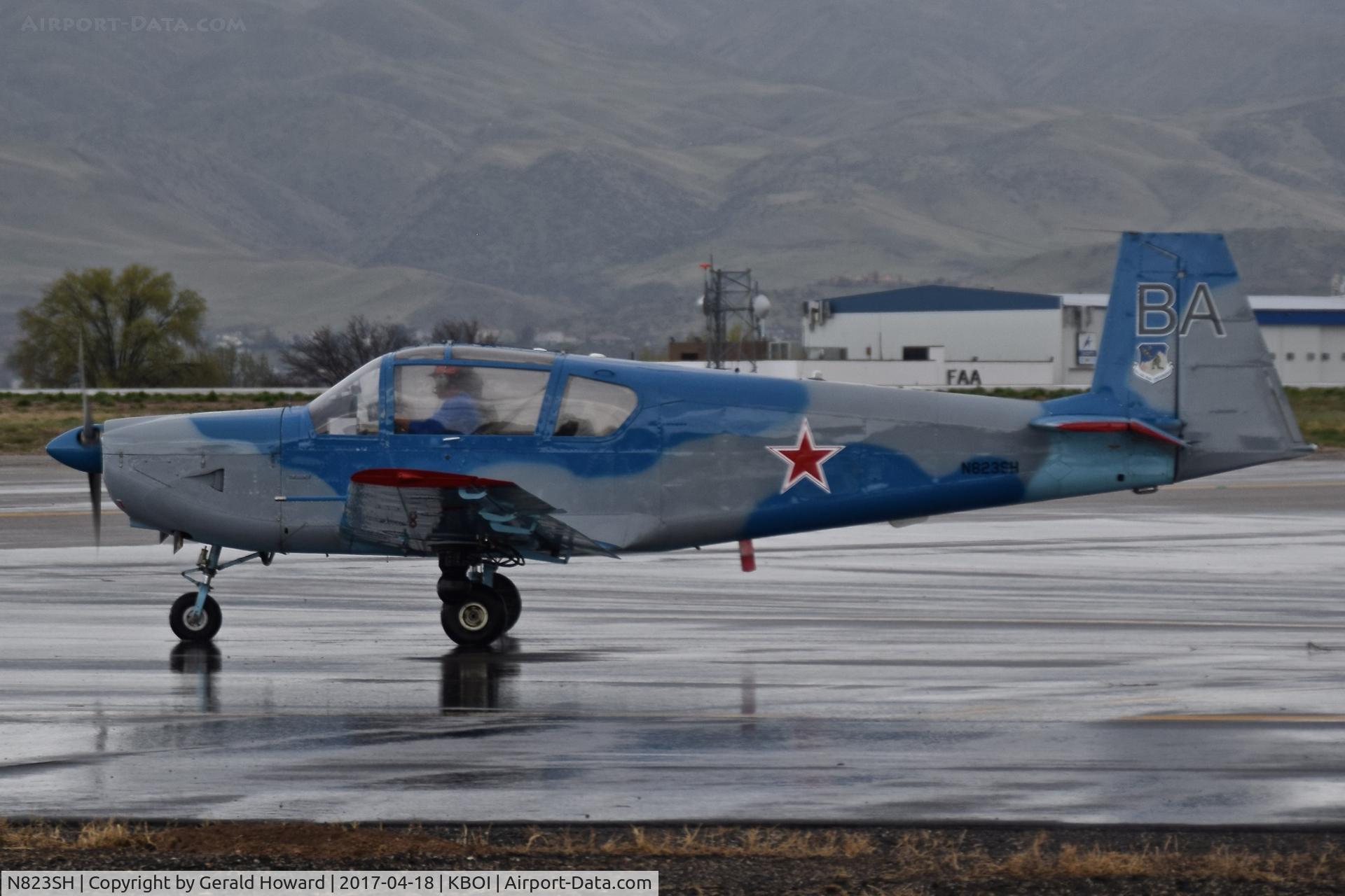 N823SH, 1975 IAR IAR-823 C/N 12, Taxiing to RWY 10R on a wet afternoon.