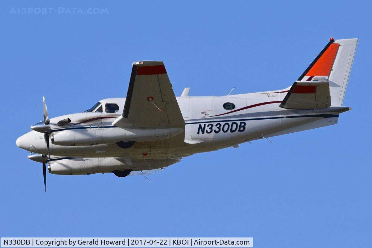 N330DB, 1999 Raytheon Aircraft Company C90A C/N LJ-1542, Flying as NIFC lead for simulated water drop. Pilot will mark water drop with smoke.
