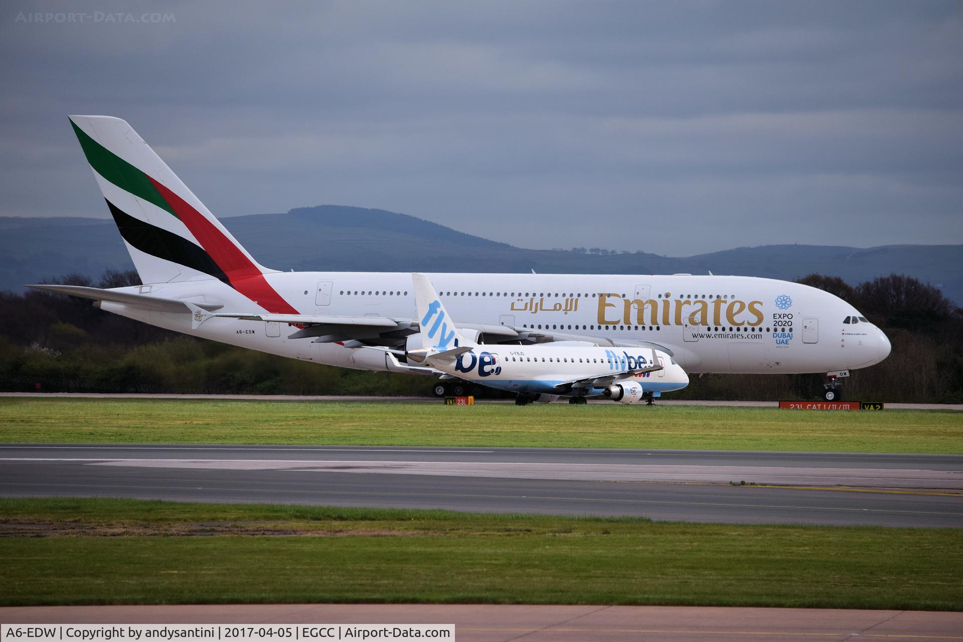 A6-EDW, 2012 Airbus A380-861 C/N 103, holding for takeoff 23L man egcc uk  at the side in the same shot [G-FBJG EMB175 BEE old col's waiting to line up on 23L