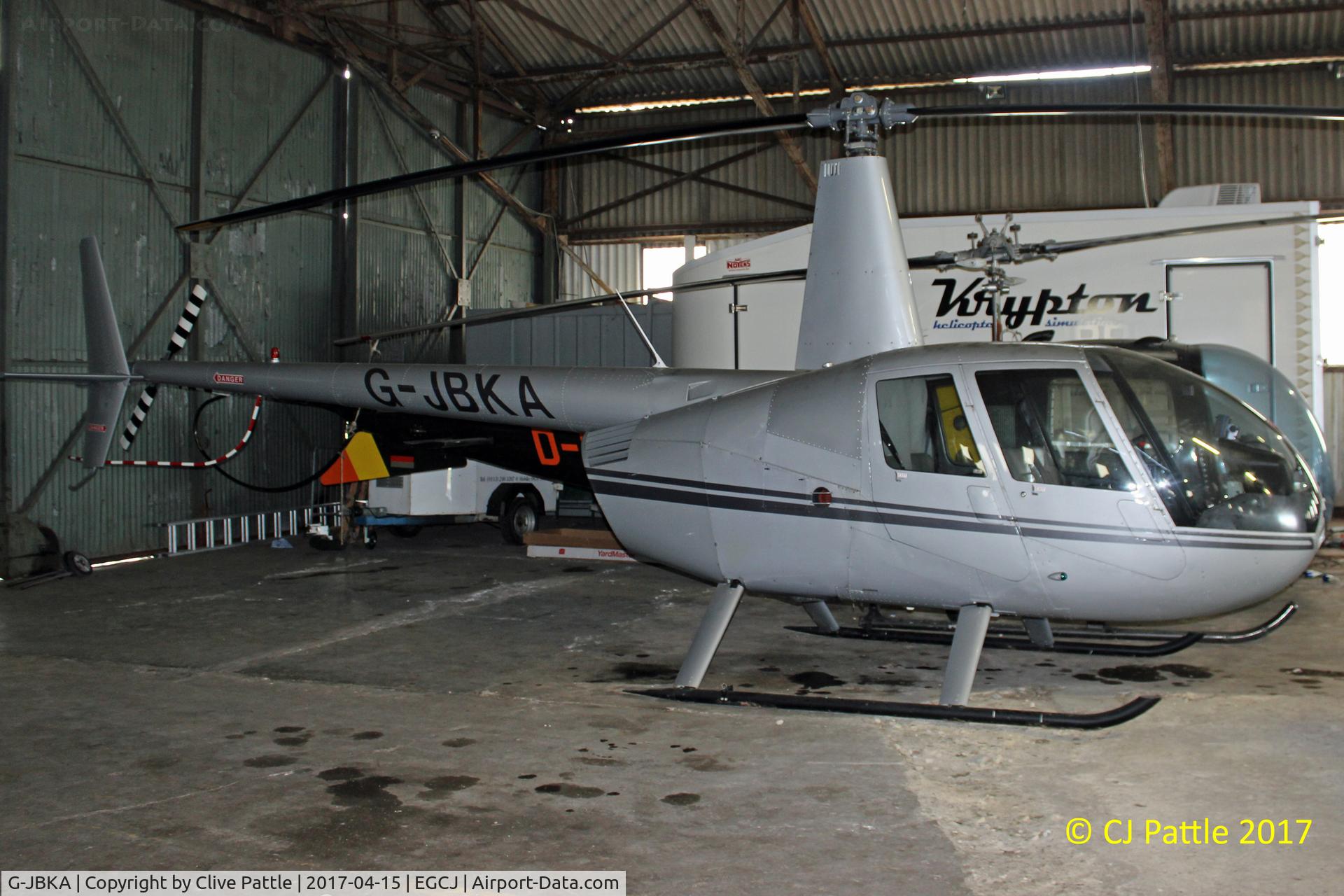 G-JBKA, 2002 Robinson R44 Raven C/N 1175, Hangared at EGCJ