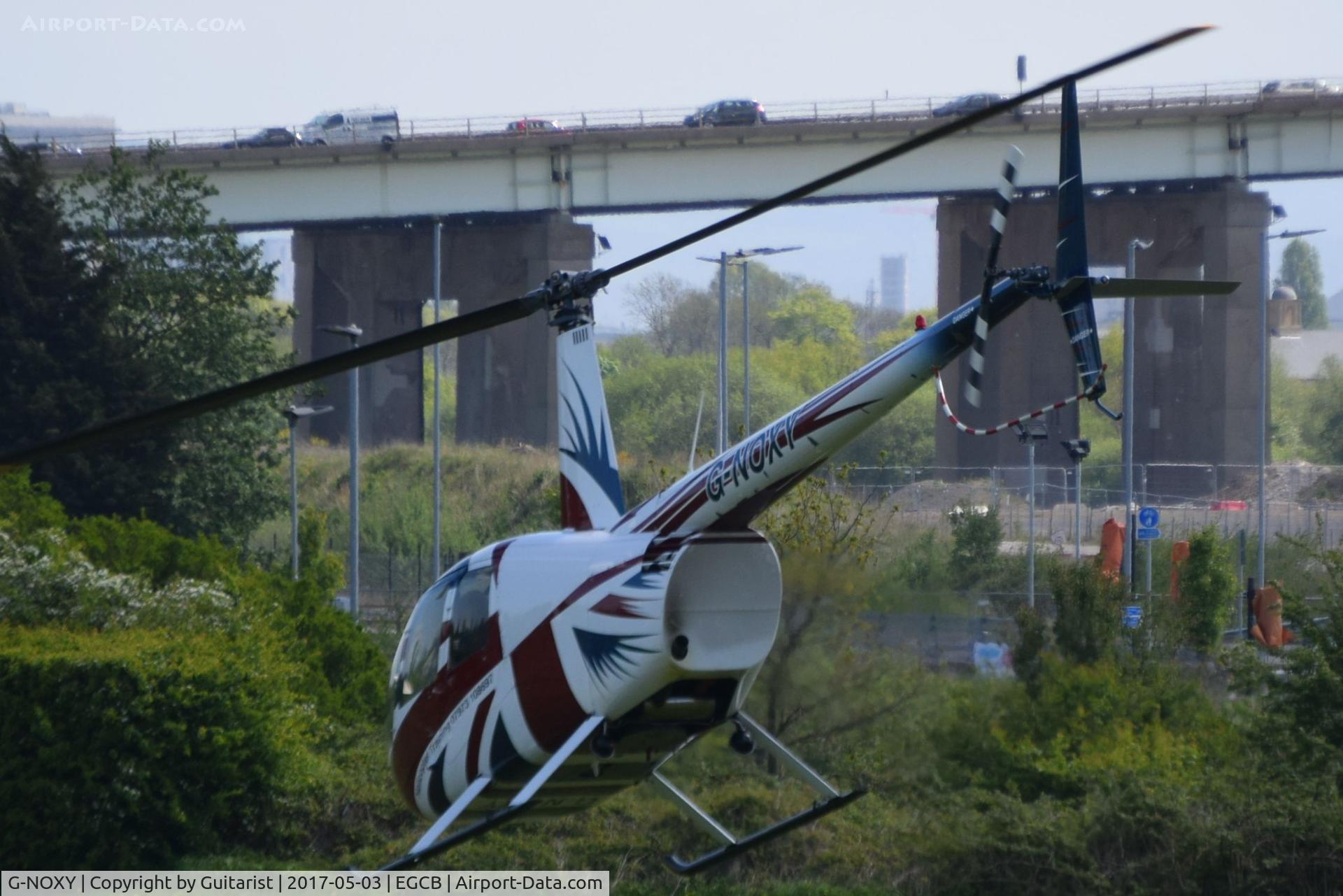 G-NOXY, 2004 Robinson R44 Raven C/N 1421, At City Airport Manchester