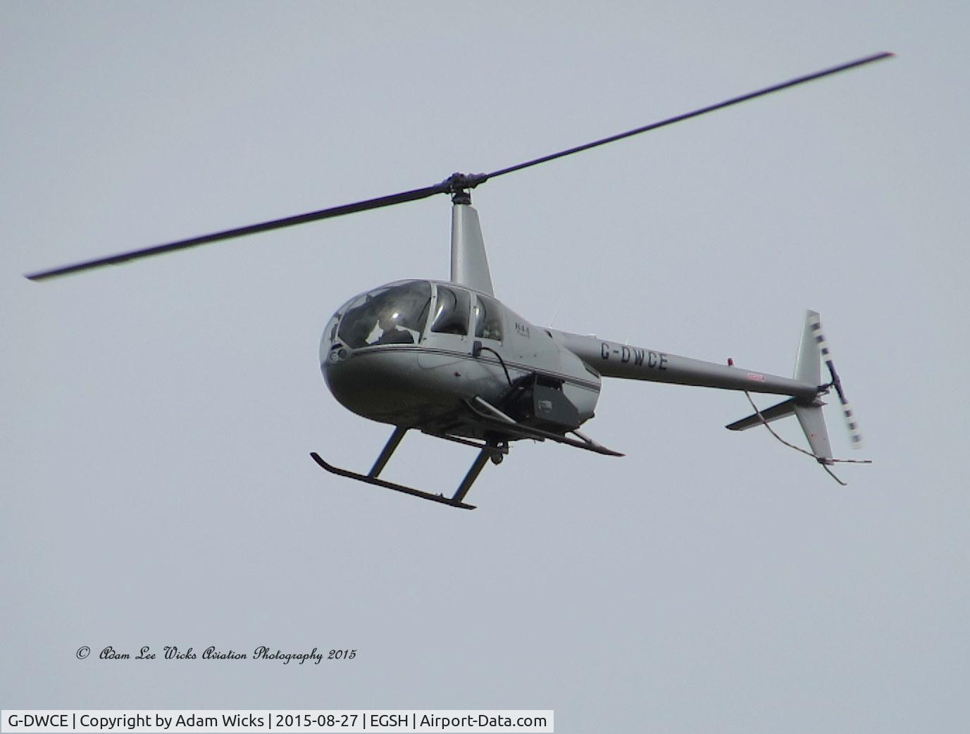 G-DWCE, 2006 Robinson R44 Raven II C/N 11511, On approach to 27 R
