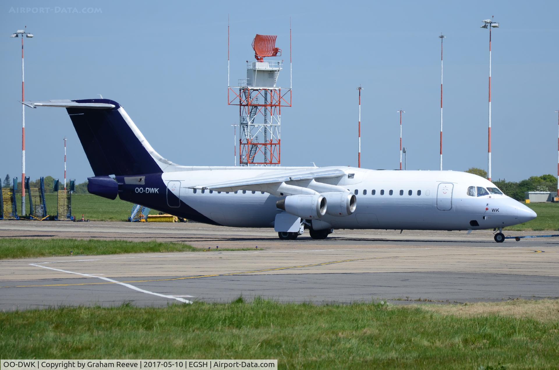 OO-DWK, 1999 British Aerospace Avro 146-RJ100 C/N E3360, Under tow at Norwich.