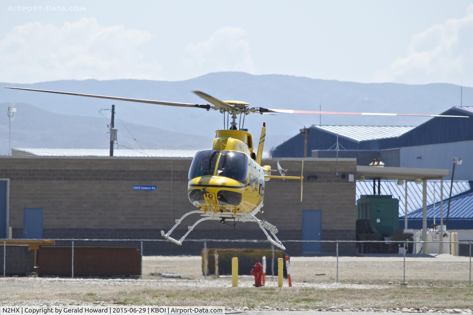 N2HX, 2000 Bell 407 C/N 53466, Lifting off from the Forest Service helicopter pad.