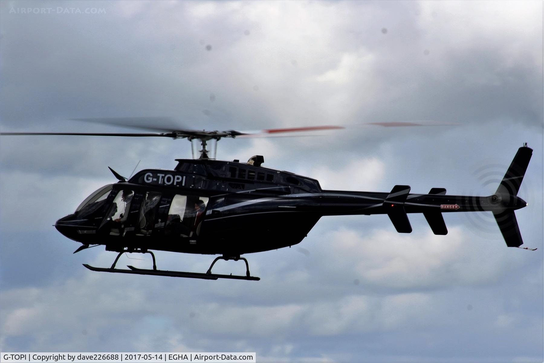 G-TOPI, 2015 Bell 407 C/N 54640, G TOPI landing at the Pooleys Flyin at Compton Abbas